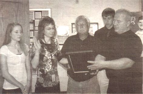 Mark Rusk swears in Granton Postmaster Melanie Boeck