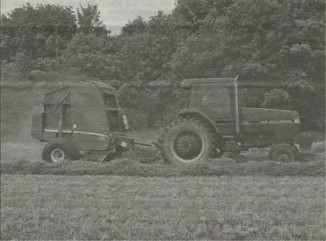 Brandon Jakobi with Round Baler and Tractor